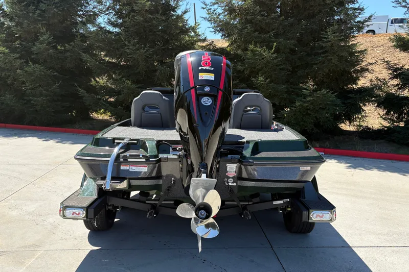Slide: The Image of 2027 Nitro Z18 XL boat with powerful outboard motor, parked outdoors. - 11