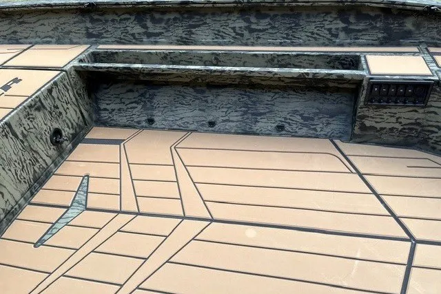 Slide: The Image of Interior view of 2027 Tracker Grizzly 1553 Timber boat with patterned flooring. - 17