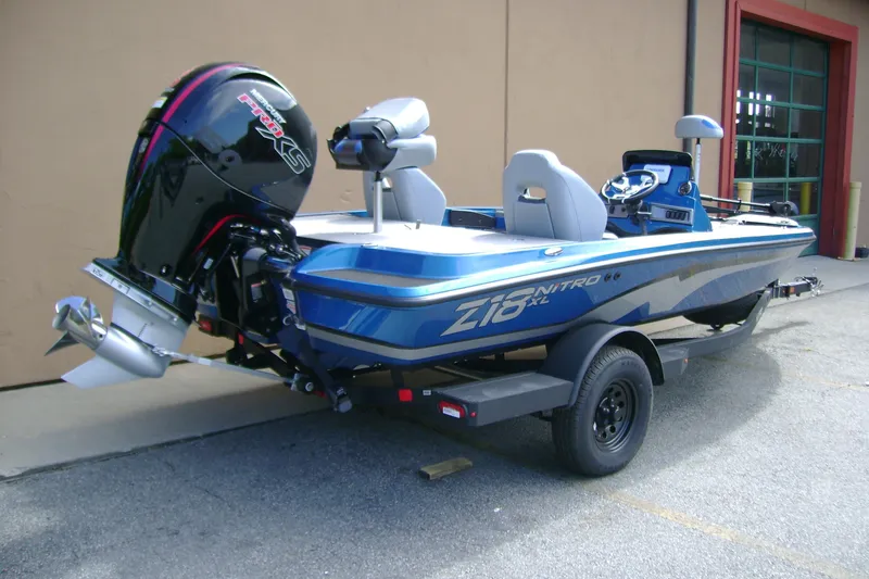 Slide: The Image of 2027 Nitro Z18 XL boat with powerful outboard motor, parked on a trailer. - 5