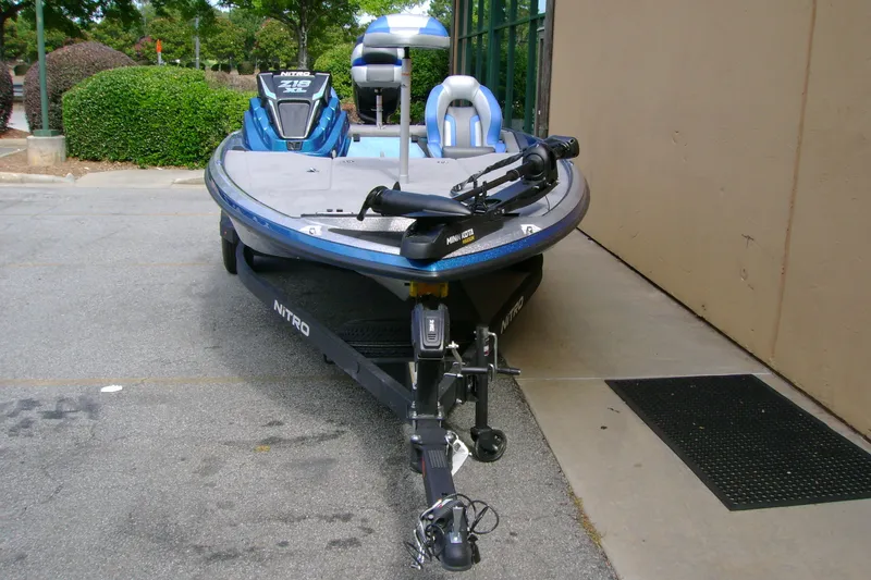Slide: The Image of 2027 Nitro Z18 XL boat parked outdoors, featuring sleek design and modern equipment. - 8