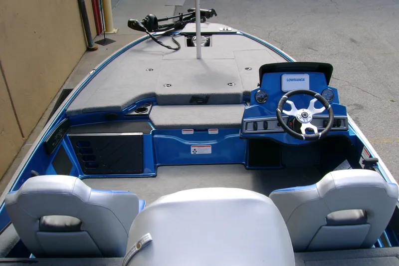 Slide: The Image of Interior view of a 2027 Nitro Z18 XL boat with steering console and seating. - 10