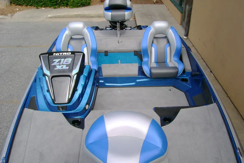 Slide: The Image of 2027 Nitro Z18 XL boat interior with blue and gray seating, showcasing modern design. - 9
