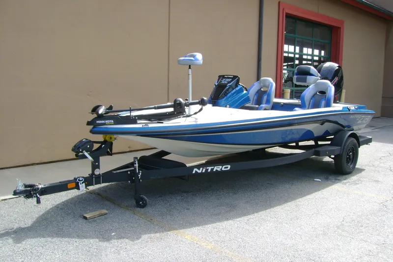 Slide: The Image of 2027 Nitro Z18 XL fishing boat on trailer, parked outdoors. - 3