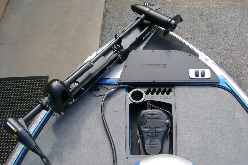 Slide: The Image of 2027 Nitro Z18 XL boat deck with Minn Kota trolling motor and storage compartments. - 11