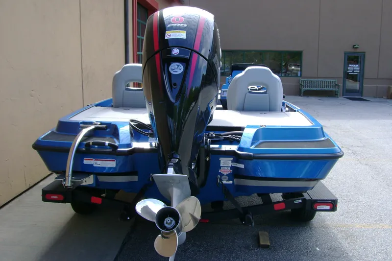 Slide: The Image of 2027 Nitro Z18 XL boat with powerful outboard motor, parked outdoors. - 7