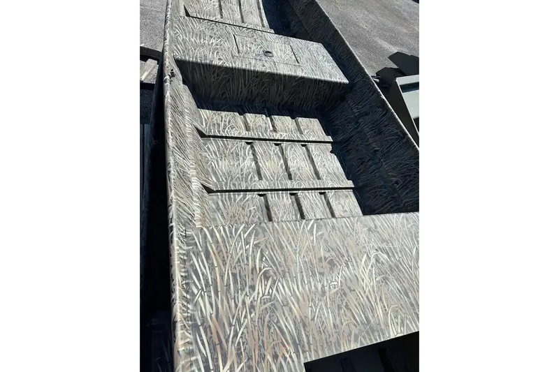 The Image of 2027 Tracker Grizzly 15 Jon boat with camouflage pattern, viewed from above. - 0