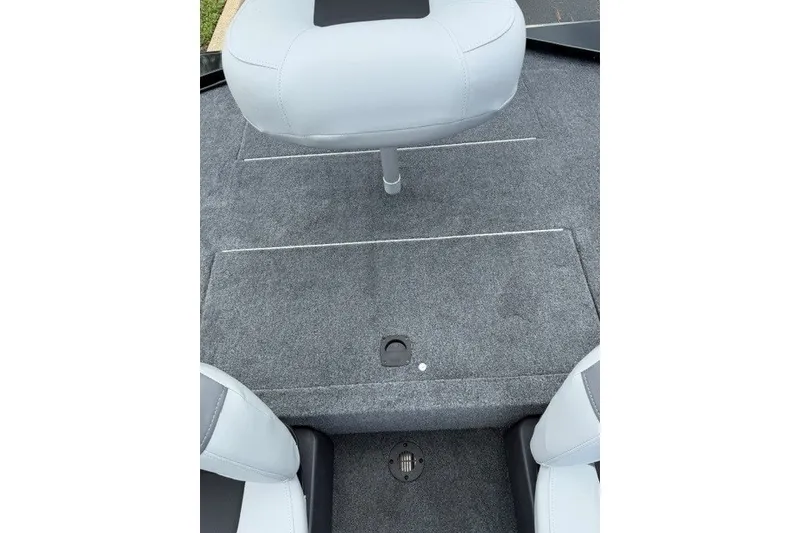 Slide: The Image of 2027 Tracker Bass Tracker Classic XL boat interior with gray carpet and seating. - 14