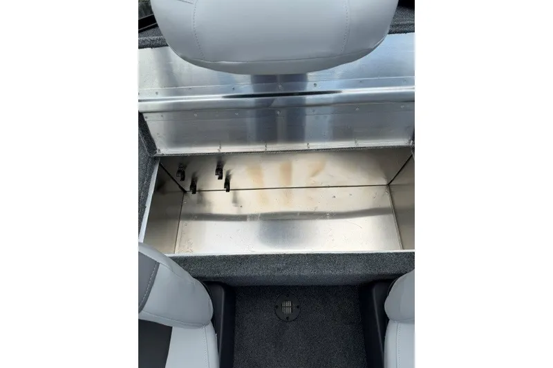 Slide: The Image of 2027 Tracker Bass Tracker Classic XL boat storage compartment with gray seating. - 15