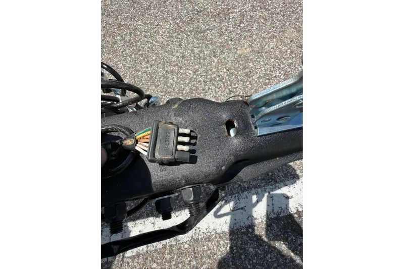 Slide: The Image of Close-up of wiring on a 2027 Tracker Grizzly 1654 T Sportsman boat trailer. - 51