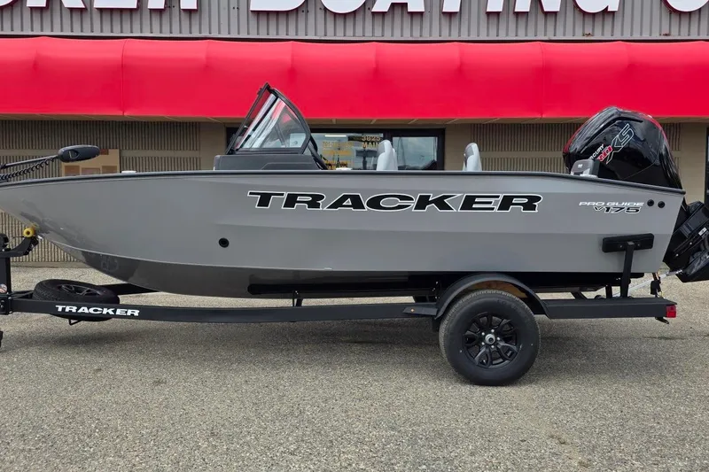 The Image of 2027 Tracker Pro Guide V-175 Combo boat on trailer, displayed outside a boating store. - 0