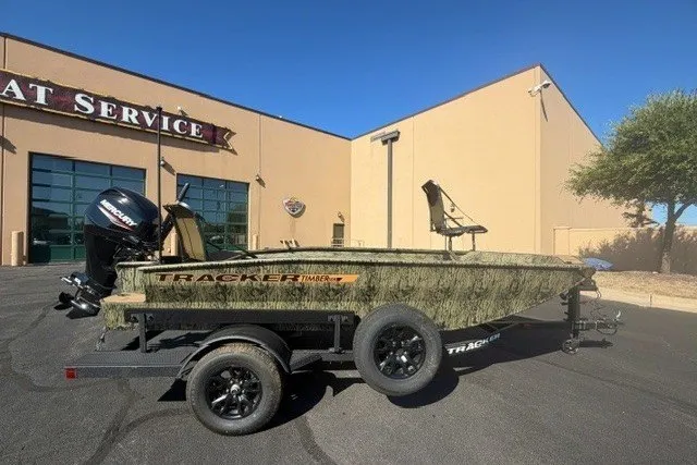 The Image of 2027 Tracker Grizzly 1553 Timber boat on trailer outside service center. - 0