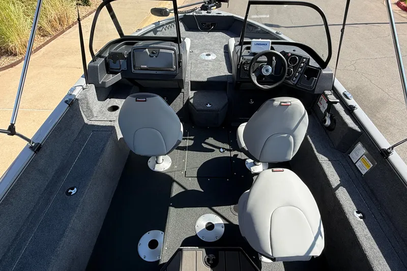 Slide: The Image of 2027 Tracker Pro Guide V-175 Combo boat interior with seating and steering console. - 17