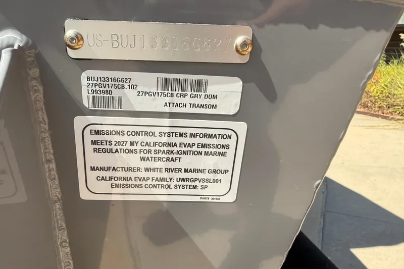 Slide: The Image of 2027 Tracker Pro Guide V-175 Combo emissions control label, California EVAP compliance details. - 18