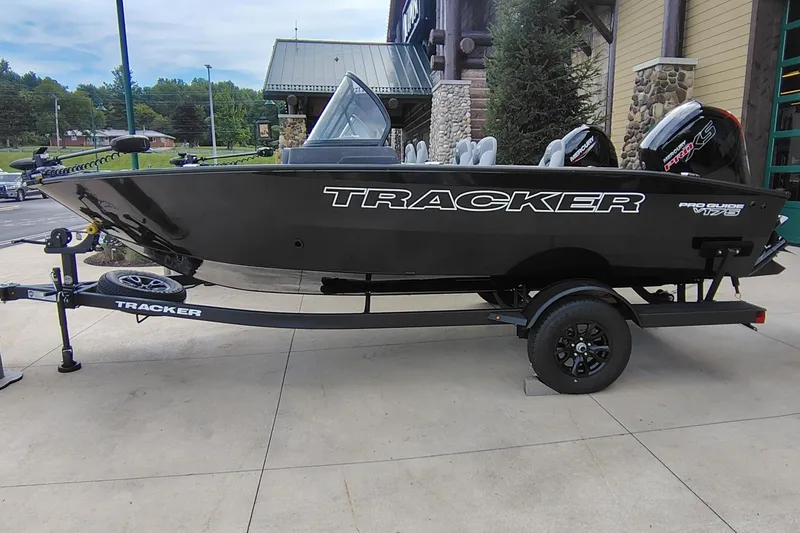 The Image of 2027 Tracker Pro Guide V-175 Combo boat on trailer, displayed outdoors. - 0