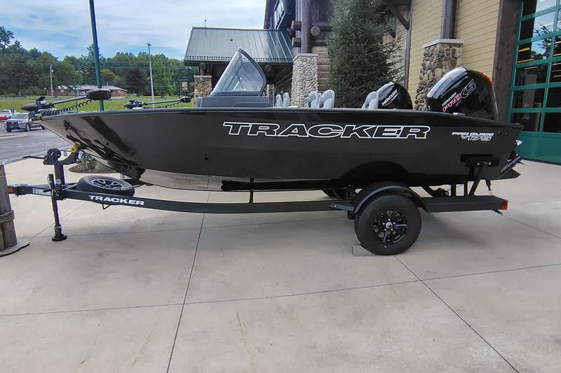 The Image of 2027 Tracker Pro Guide V-175 Combo boat on trailer, displayed outdoors. - 0