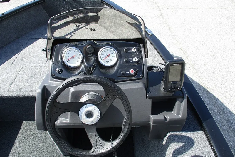 Slide: The Image of 2027 Tracker Super Guide V-16 SC boat dashboard with steering wheel and gauges. - 19
