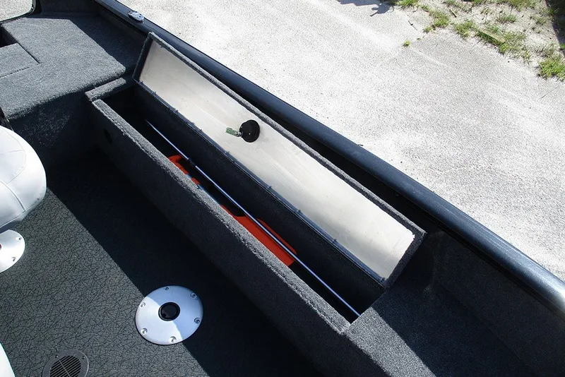 Slide: The Image of 2027 Tracker Super Guide V-16 SC boat interior with open storage compartment. - 17