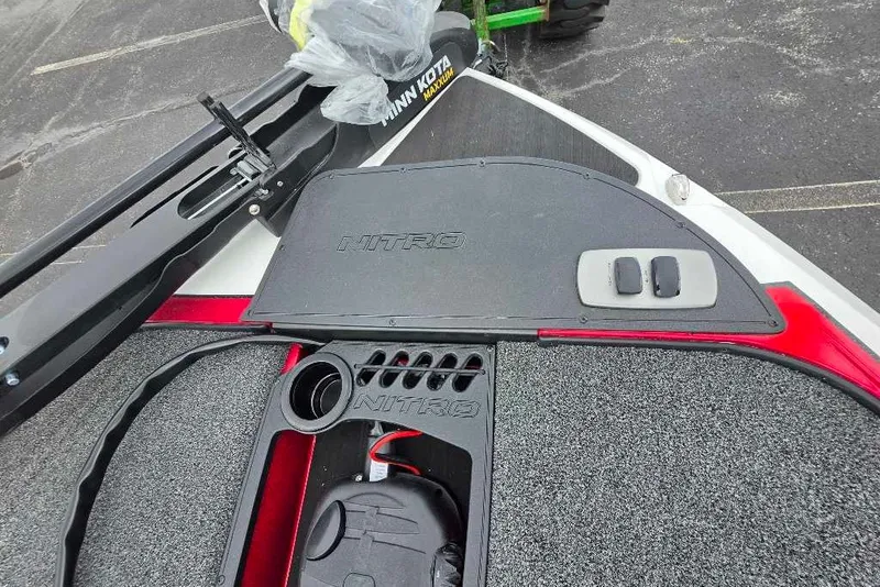 Slide: The Image of 2027 Nitro Z18 XL boat deck with Minn Kota trolling motor and control panel. - 8