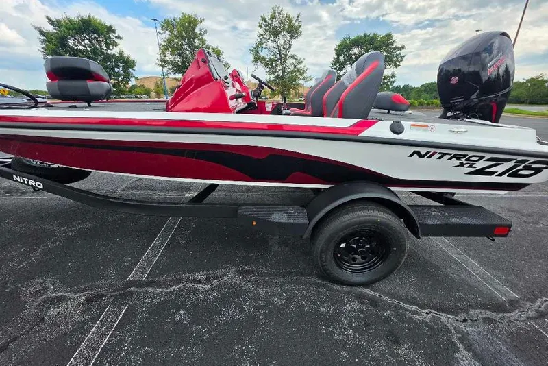 Slide: The Image of 2027 Nitro Z18 XL boat with red and white design on a trailer. - 2