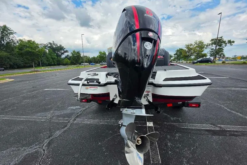 Slide: The Image of Rear view of a 2027 Nitro Z18 XL boat in a parking lot. - 4