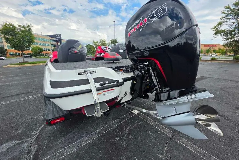Slide: The Image of 2027 Nitro Z18 XL boat with powerful outboard motor in a parking lot. - 3
