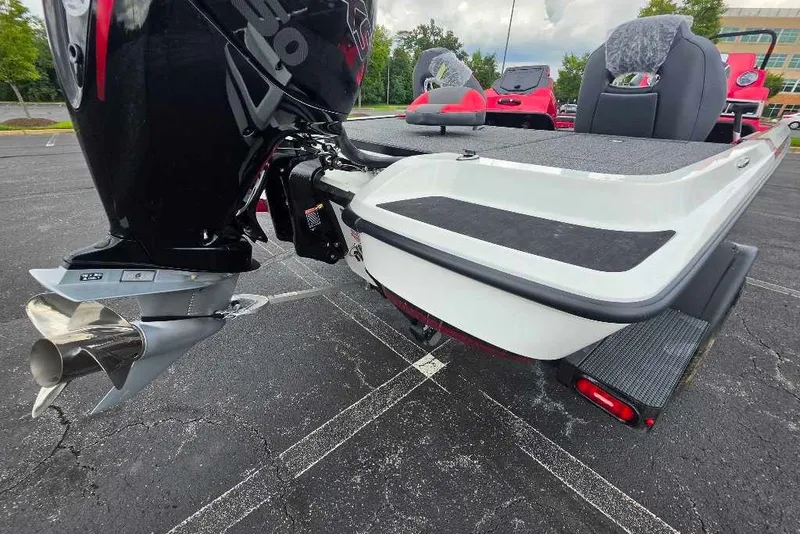 Slide: The Image of 2027 Nitro Z18 XL boat rear view with powerful outboard motor in parking lot. - 5