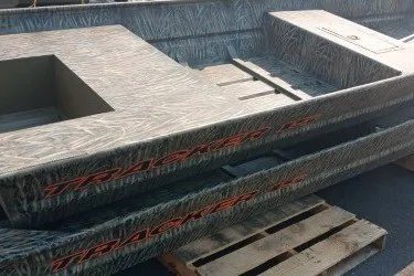 The Image of 2027 Tracker Grizzly 15 Jon boat on wooden pallets, showcasing rugged design. - 0