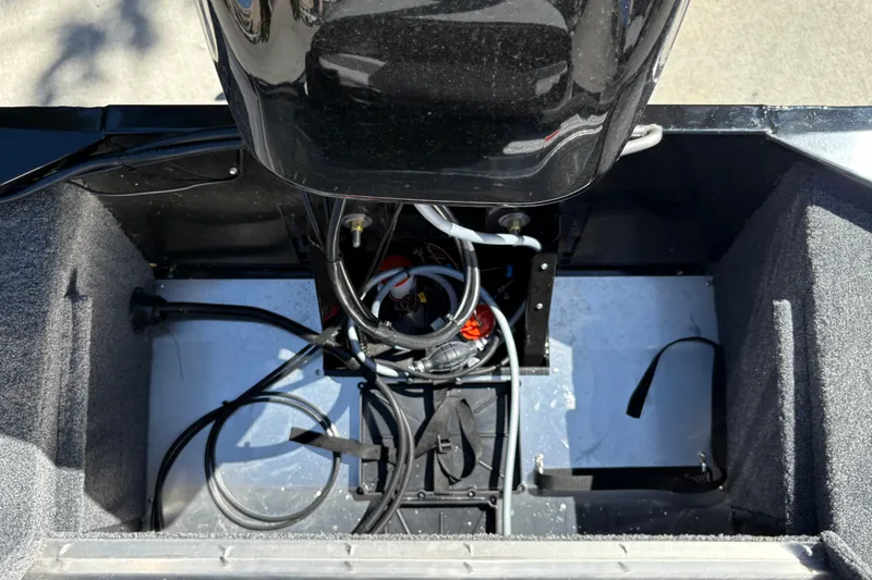 Slide: The Image of 2027 Tracker Bass Tracker Classic XL boat engine compartment with wiring and components. - 18