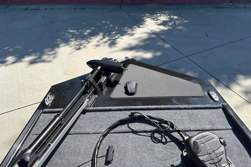 Slide: The Image of 2027 Tracker Bass Tracker Classic XL boat deck with trolling motor and foot pedal. - 24
