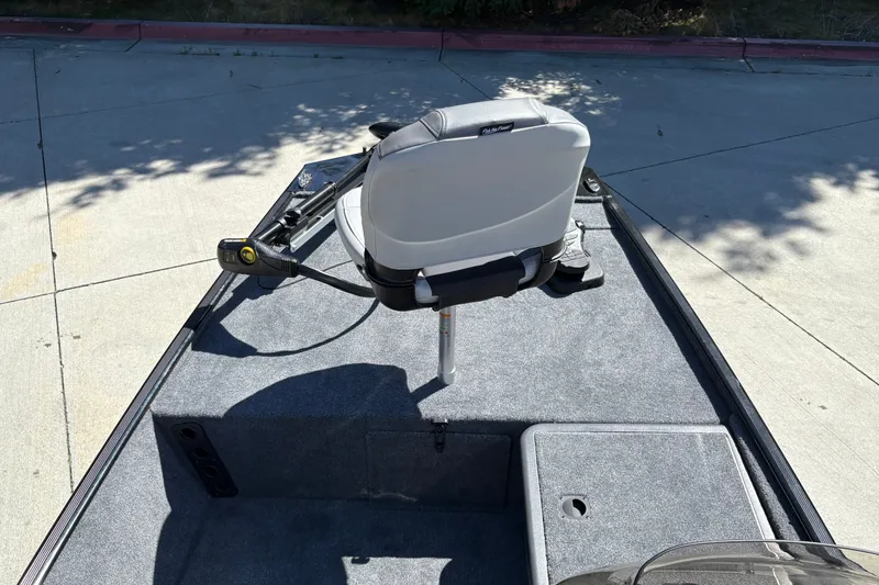 Slide: The Image of 2027 Tracker Bass Tracker Classic XL boat interior with seat and trolling motor. - 14