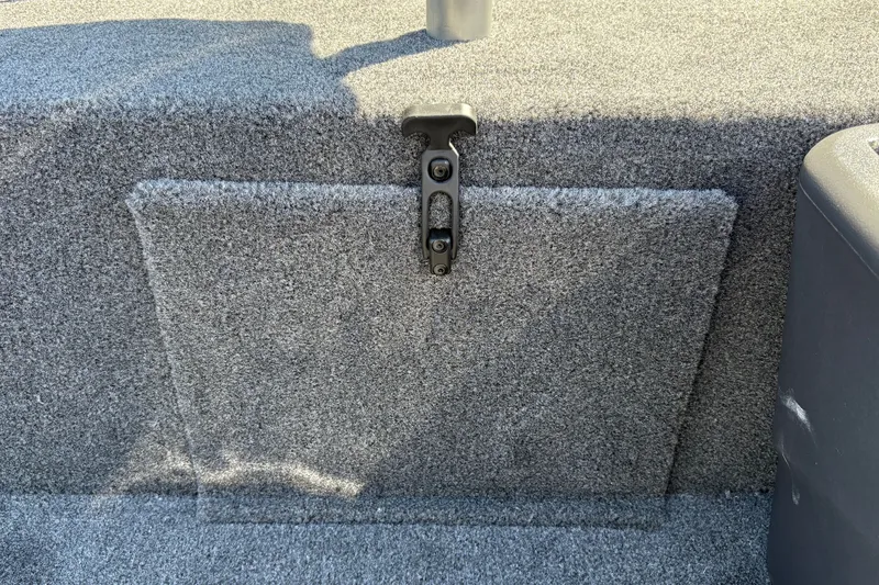 Slide: The Image of 2027 Tracker Bass Tracker Classic XL boat carpeted storage compartment with latch. - 29