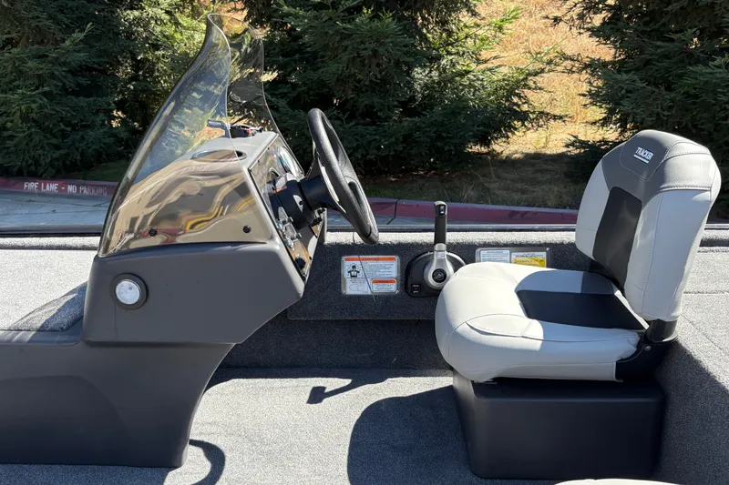 Slide: The Image of Interior of 2027 Tracker Bass Tracker Classic XL boat with steering console and seat. - 16