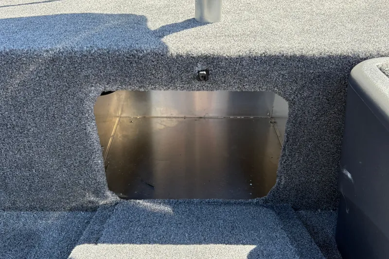 Slide: The Image of Carpeted storage compartment in 2027 Tracker Bass Tracker Classic XL boat. - 31