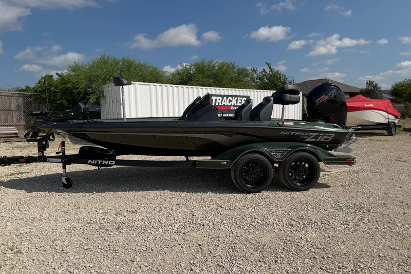 The Image of 2027 Nitro Z18 XL Pro boat on trailer, parked outdoors under a clear sky. - 0