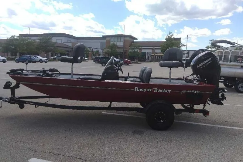 Slide: The Image of 2027 Tracker Bass Tracker Classic XL boat in parking lot, side view. - 50