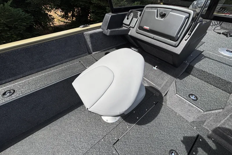 Slide: The Image of Interior of 2027 Tracker Pro Guide V-175 Combo boat with gray seating and console. - 48