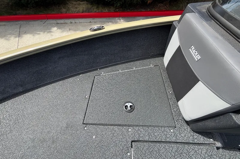 Slide: The Image of 2027 Tracker Pro Guide V-175 Combo boat interior with storage compartment and seating. - 49