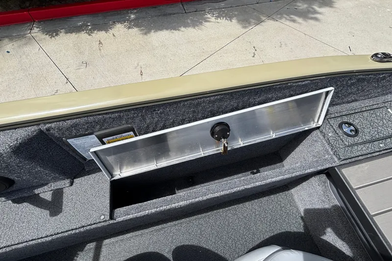 Slide: The Image of 2027 Tracker Pro Guide V-175 Combo boat interior with open storage compartment. - 35