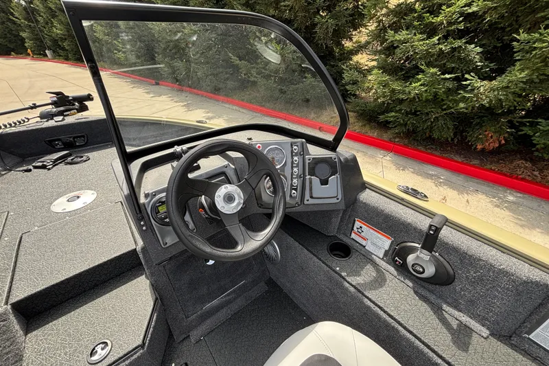 Slide: The Image of 2027 Tracker Pro Guide V-175 Combo boat interior with steering wheel and control panel. - 43