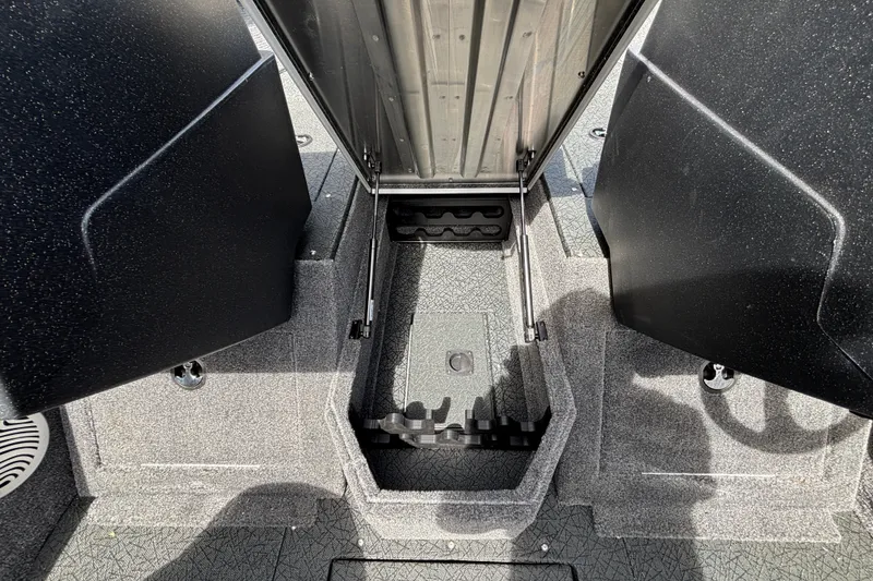 Slide: The Image of 2027 Tracker Pro Guide V-175 Combo boat interior storage compartment with open lid. - 50