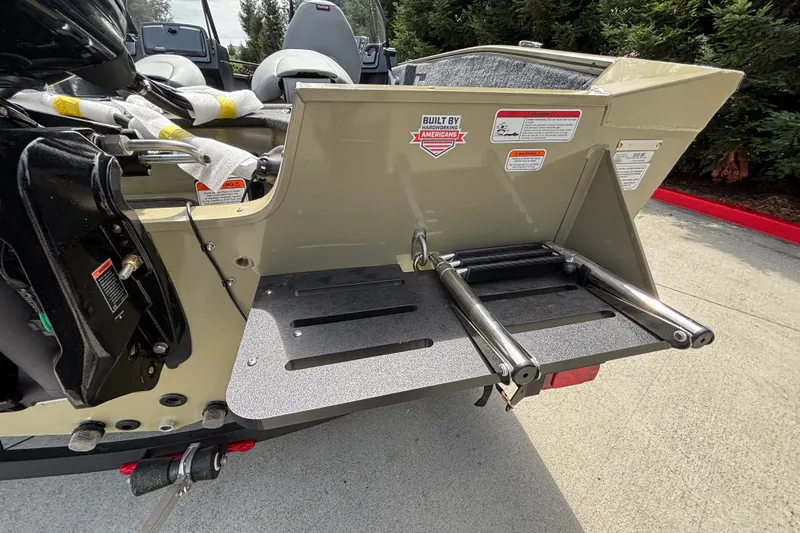 Slide: The Image of Rear view of 2027 Tracker Pro Guide V-175 Combo boat with ladder and motor details. - 21