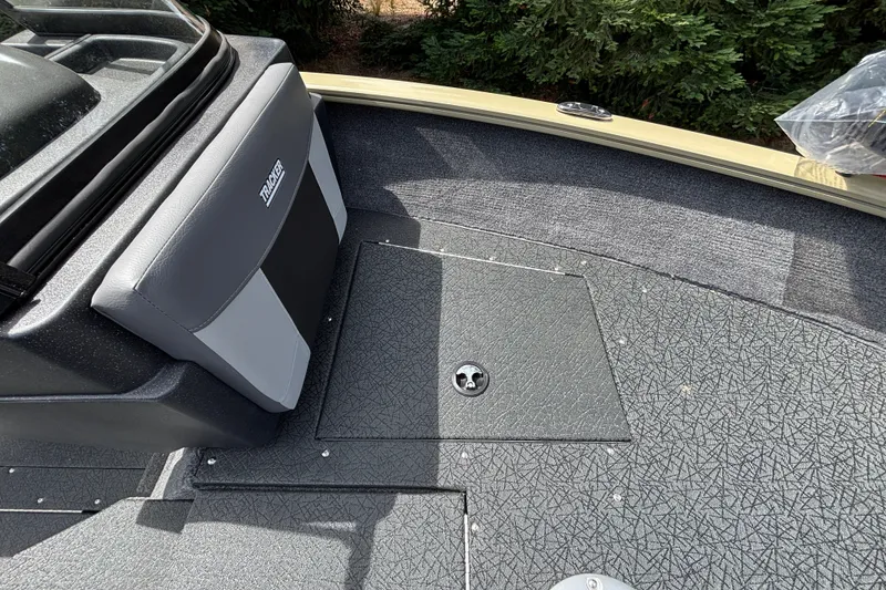 Slide: The Image of 2027 Tracker Pro Guide V-175 Combo boat interior with textured flooring and seating. - 53