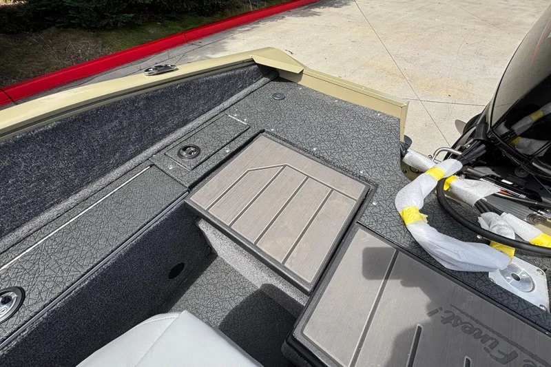 Slide: The Image of Interior view of 2027 Tracker Pro Guide V-175 Combo boat, showcasing deck and seating area. - 33