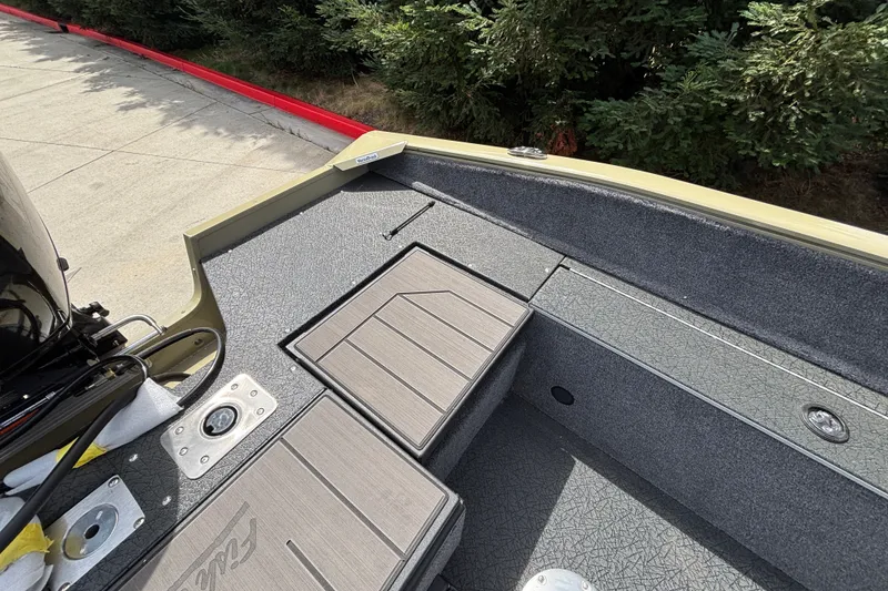 Slide: The Image of 2027 Tracker Pro Guide V-175 Combo boat interior with storage compartments and textured flooring. - 41