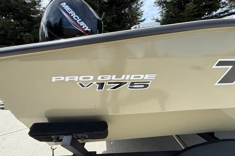 Slide: The Image of 2027 Tracker Pro Guide V-175 Combo boat with Mercury engine, side view. - 13
