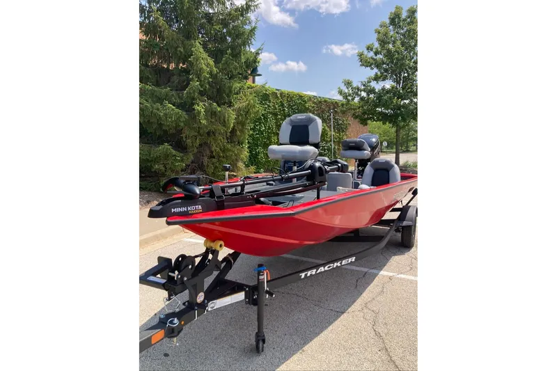 Slide: The Image of 2027 Tracker Pro Team 175 boat on trailer, parked outdoors. - 13