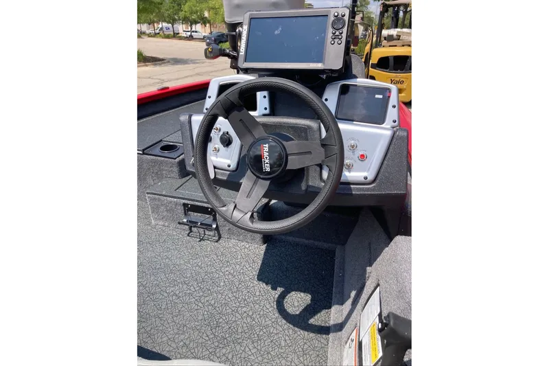 Slide: The Image of 2027 Tracker Pro Team 175 boat dashboard with steering wheel and electronic displays. - 16