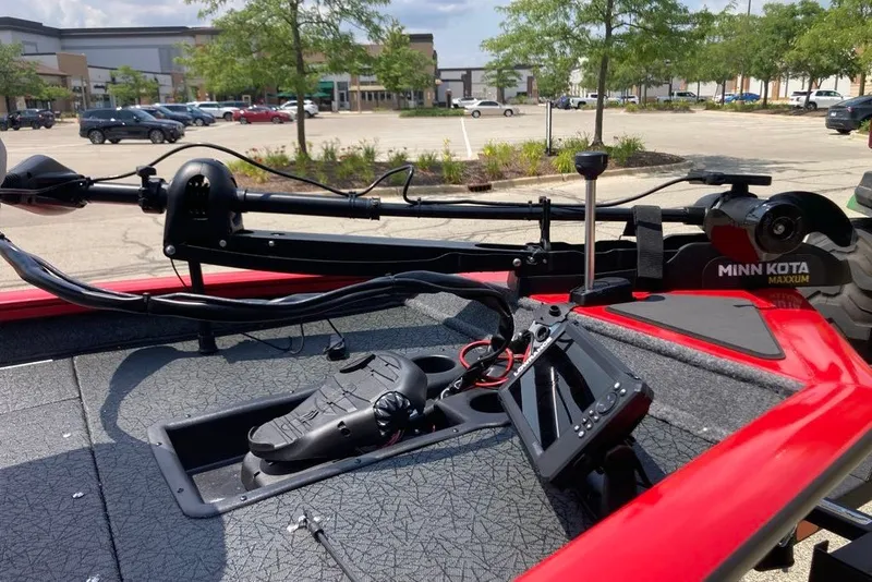 Slide: The Image of 2027 Tracker Pro Team 175 boat with Minn Kota Maxxum trolling motor in a parking lot. - 19
