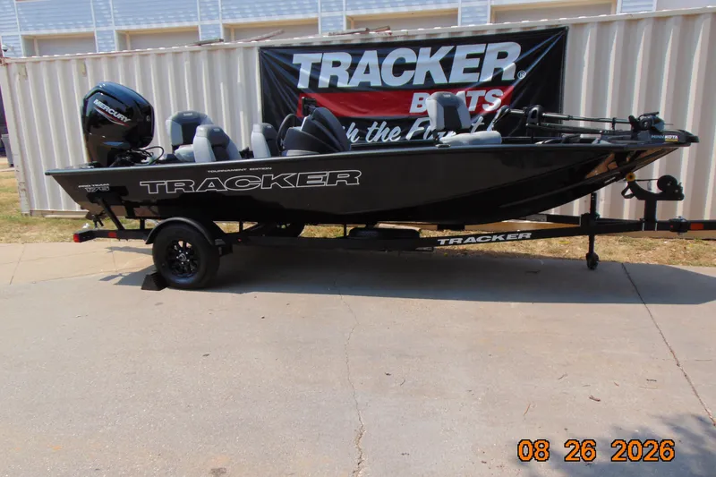 The Image of 2027 Tracker Pro Team 175 boat on trailer, displayed outdoors. - 0