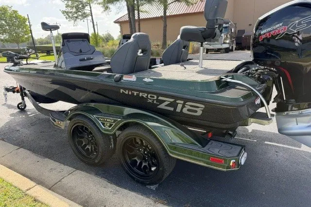 Slide: The Image of 2027 Nitro Z18 XL boat with dual axle trailer and Mercury Pro XS engine. - 2